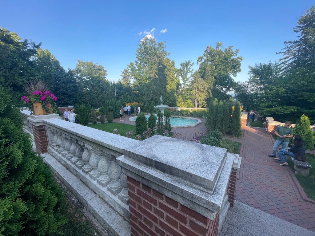 A view of the mansion gardens that feature a neo-classical architectural style.