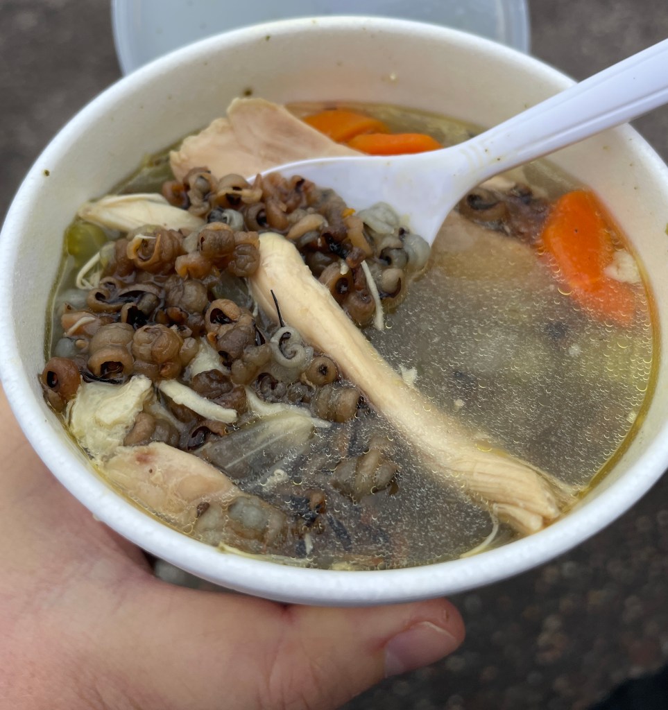 Close-up of chicken and wild rice soup in a cup