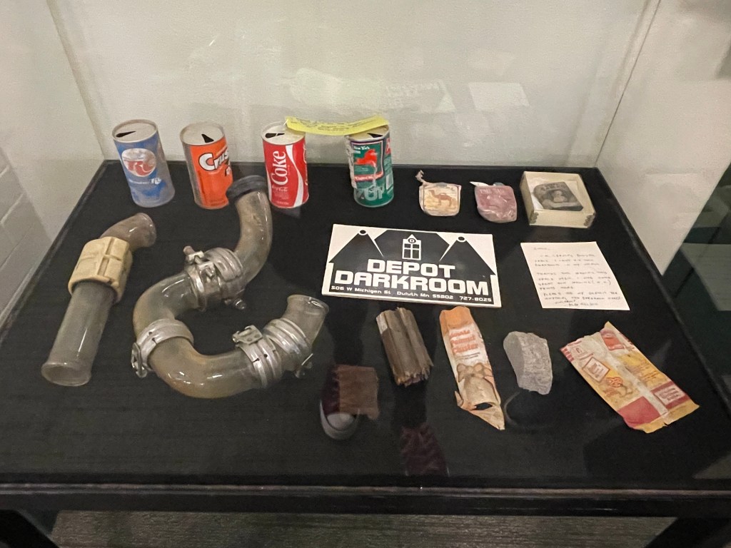 A display of items found in the walls of The Depot during renovation
