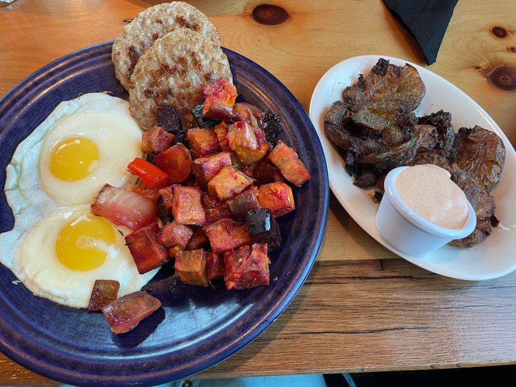 two eggs, local sausage, "red flannel hash" (beets, potatoes, carrots, and onions), and a side of smashed dill potatoes